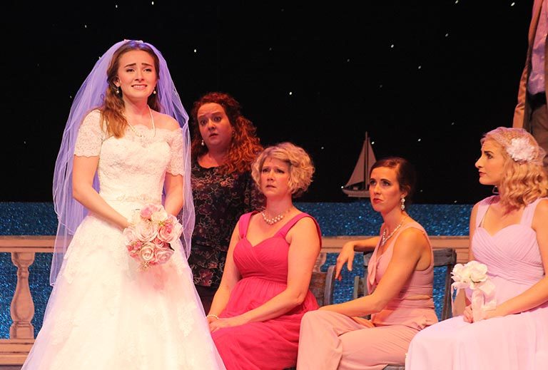 Lauren Mary Moore in wedding dress with cast during Momma Mia
